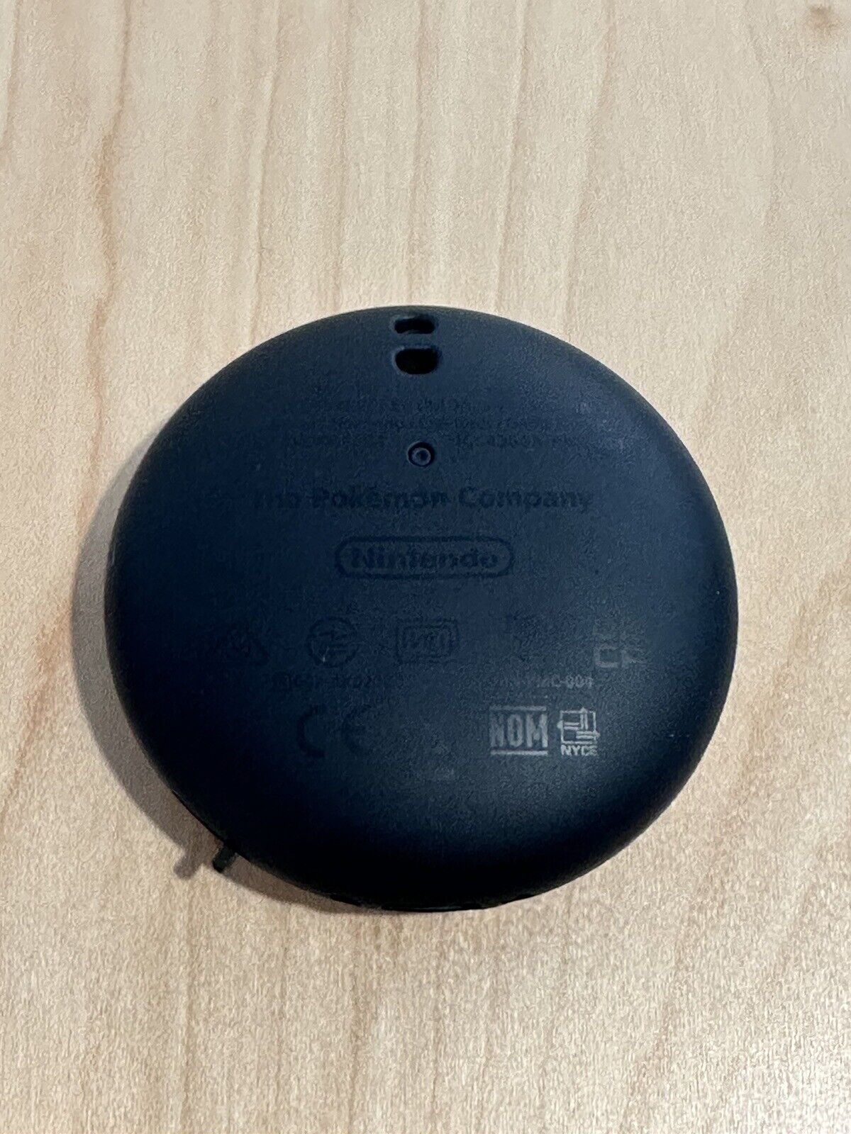 Image of a modified version of Nintendo's Pokemon GO Plus Plus, a Pokemon GO automatic catcher.